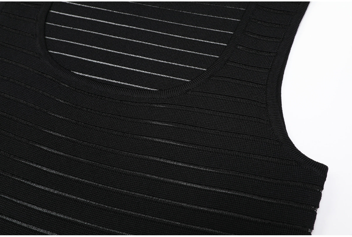 Upper bodice detail of black striped knit dress
