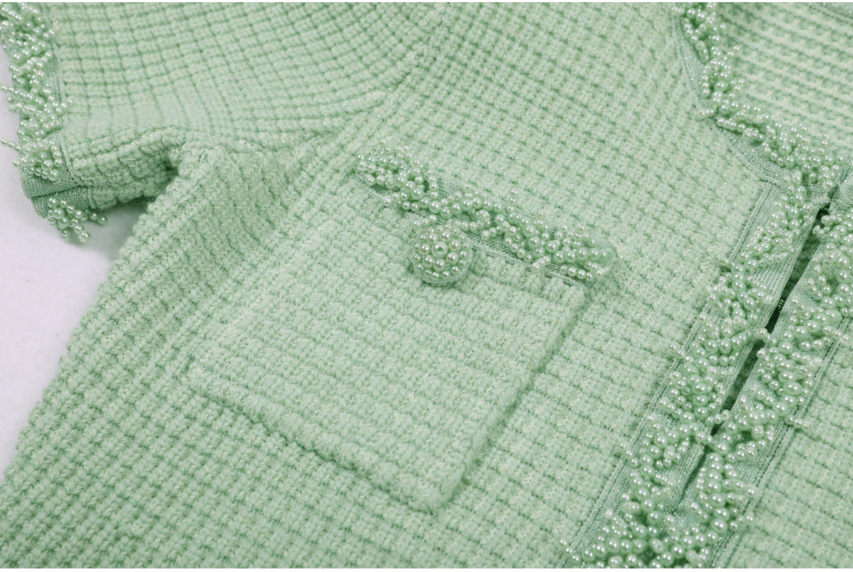 Mint green dress upper body with pearl embellishments on neckline