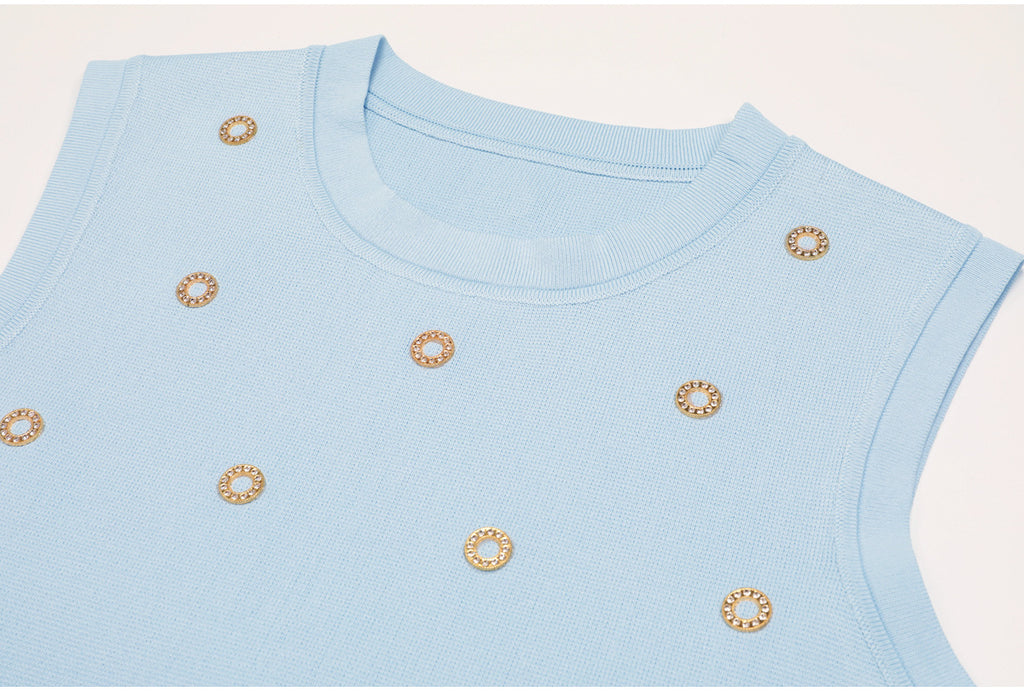 Top detail of blue embellished knit tank with finished neckline