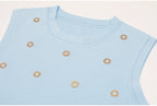 Top detail of blue embellished knit tank with finished neckline