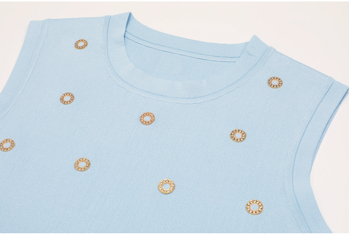 Top detail of blue embellished knit tank with finished neckline